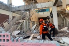 Rescuers race to find survivors after Indonesia earthquake kills 51