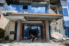 Race against time to find Indonesia earthquake survivors after 51 killed
