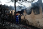 Couple found dead and 500 beachgoers evacuated as wildfires engulf Greek island