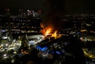 About 100 firefighters tackle blaze at recycling facility