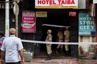 Nine killed including girl, four, as hotel in India goes up in flames
