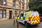 Police hunt for witnesses after two men found dead in Glasgow flat