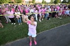 Women in pink rally in support of Lindsay Clancy who is on trial for killing 3 children