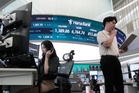 Asian shares are mixed following Wall Street losses as US Treasury's moves fail to calm markets