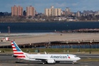 Plane passenger treated for burns after laptop catches on fire during flight