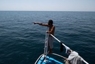 2 bodies recovered and about 12 missing after migrant boat capsized off Tunisian coast