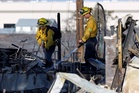 Reno wildfire tears through homes as National Guard joins desperate fight