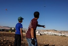 Israel threatens to shoot down kites drifting across border from Gaza