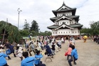 Japan enlists 1,800 people to pull a 360-tonne castle more than two metres by hand