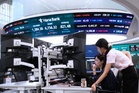 Asian shares mostly rise as oil prices fall and hope grows for AI