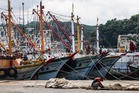 Typhoon Saudel causes blackouts and flight cancellations after slamming into remote Japanese islands