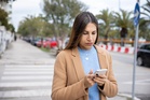 Pedestrians in Italy could be fined for crossing the road while looking at phone