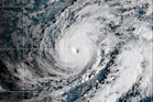 Hawaii residents told to expect tropical storm conditions as Hurricane Lowell passes to the west