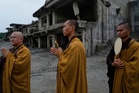 Nepal holds a day of mourning after floods kill 1,300