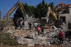 Israeli airstrikes hit southern Lebanon village, killing 9, and other Mideast news