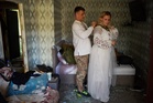 A Russian strike tore apart a couple's home on the eve of their wedding. They still got married