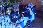 Moment man tries to fire point-blank at his ex in a restaurant - but is stopped by the gun’s safety and a daring waiter