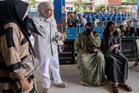 Six people dead and 130 missing after Indonesian ferry overturns in rough seas