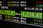 Asian shares are mixed and OpenAI investor SoftBank shares plunge after calls to slow AI industry