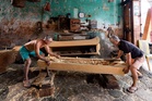 Two brothers carry on the traditional art of handmade Chinese coffins in Malaysia, in photos
