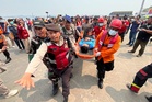 Indonesian divers recover 3 bodies from capsized ferry as salvage operation begins