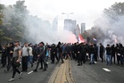 Dutch riot police break up far-right protest in The Hague after violence erupts