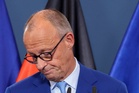 Germany’s Merz vows to press on with reforms after historic state election defeat