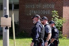 Up to 30 shots fired after man opened fire on officer outside Ontario synagogue