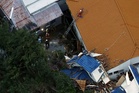 Japan’s Typhoon Dujuan leaves 10 dead as rescuers continue to search for four missing