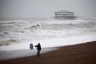 Section of historic pier falls into sea as Storm Austen hammers UK with 110mph winds
