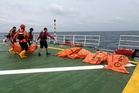 Indonesian divers recover 52 bodies from capsized ferry as 83 people remain missing