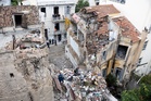 Young woman among two dead as building collapses after explosion near the Acropolis in Athens
