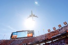 College football fans enjoy low-altitude Air Force One flyover as Trump attends game