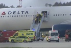 Delta passengers injured in emergency landing after smoke filled cabin during flight