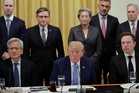 Trump and tech leaders sign a voluntary White House accord for reviews of AI