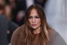 Jennifer Lopez sits front row for Stella McCartney’s rain-soaked Paris Fashion Week show