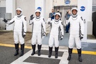 Four astronauts being launched into space for six-month trip