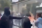Rioter attacks woman with improvised flamethrower during French student protests