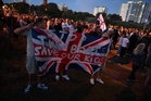 Anti-migrant protesters gather in seaside town as dinghy arrives in UK