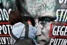 Russian police arrest anti-Kremlin protesters after rare display of dissent