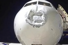 Plane damaged by suspected lightning strike lands safely with over 100 passengers on board