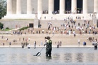 Trump insists the Reflecting Pool revamp is complete. So why are crews still working on it?