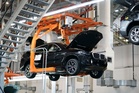 FACT FOCUS: Trump says tariffs have brought more US auto factories. His numbers are off.