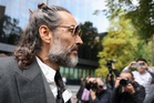 Russell Brand ‘raped woman after asking her to take photos of him’, court told