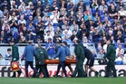 Emi Martinez stretched off pitch after clashing heads with Everton star