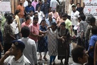 At least 19 dead as sudden downpour triggers stampede at Hindu festival in India
