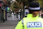 Hunt for man and woman after police officer injured in shooting