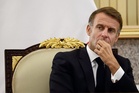 Macron accused of being ‘out of touch’ for flying to Kuwait as France gripped by violence and looting