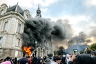 French mayor calls for Notre Dame-style rebuild after historic town hall set on fire by rioters