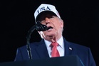 Trump mimics punching protesters after North Carolina rally repeatedly interrupted